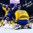 BUFFALO, NEW YORK - JANUARY 4: Sweden's Filip Gustavsson #30 covers the puck between his pads as USA's Ryan Poehling #4 searches for a rebound during the semi-final round of the 2018 IIHF World Junior Championship. (Photo by Andrea Cardin/HHOF-IIHF Images)

